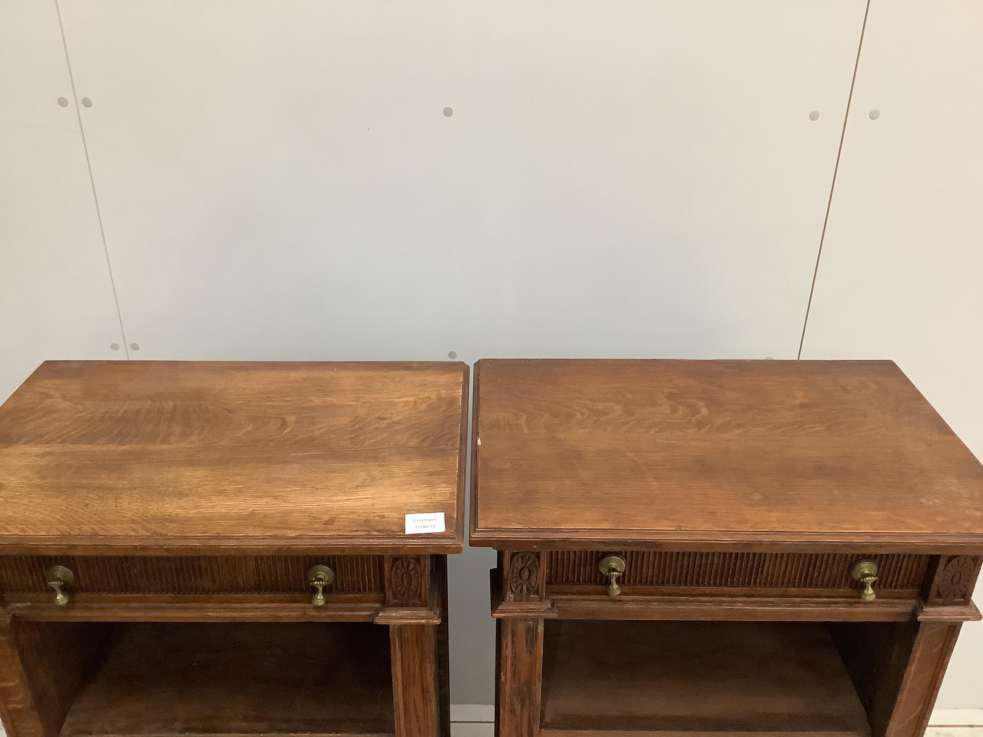 A pair of early 20th century oak open bookcases, width 58cm, depth 38cm, height 107cm
